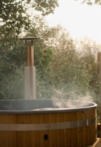 Hot tub at Eavestone Lake, looking over the sunset