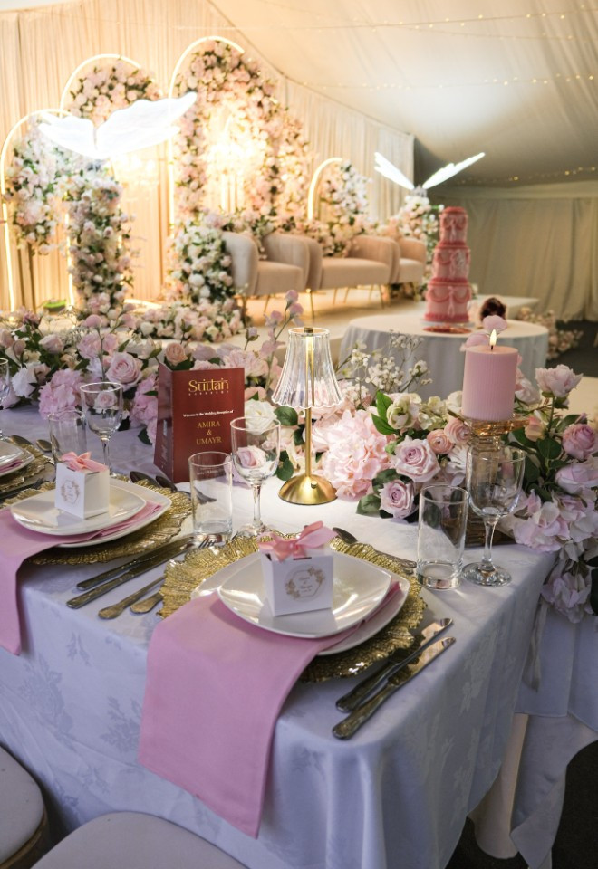 pink & gold themed asian wedding in the marquee at Trunkwell House. pink and white flowers with pink tiered wedding cake. Berkshire asian wedding venue
