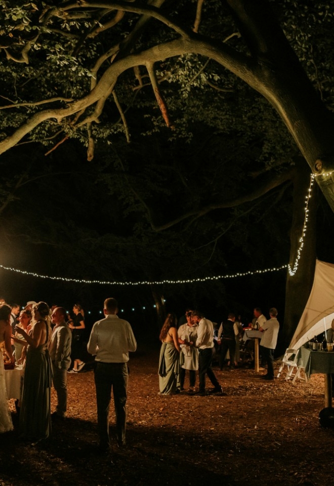 Wedding evening reception in the woodland with marquee at Monkton Barn wedding venue Buckinghamshire