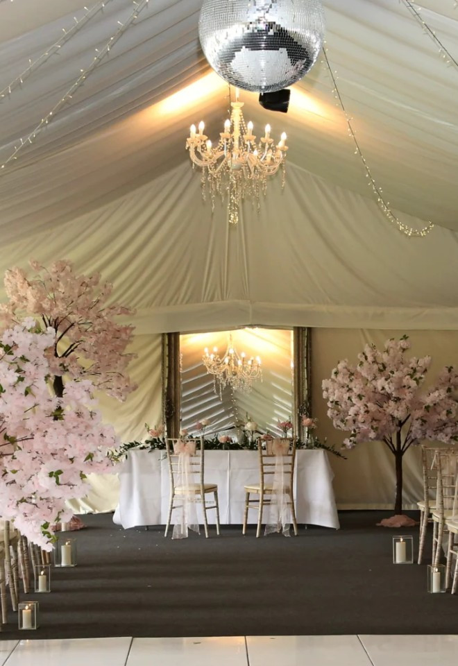 Marquee wedding at Trunkwell House with cherry blossom trees, Berkshire wedding venue