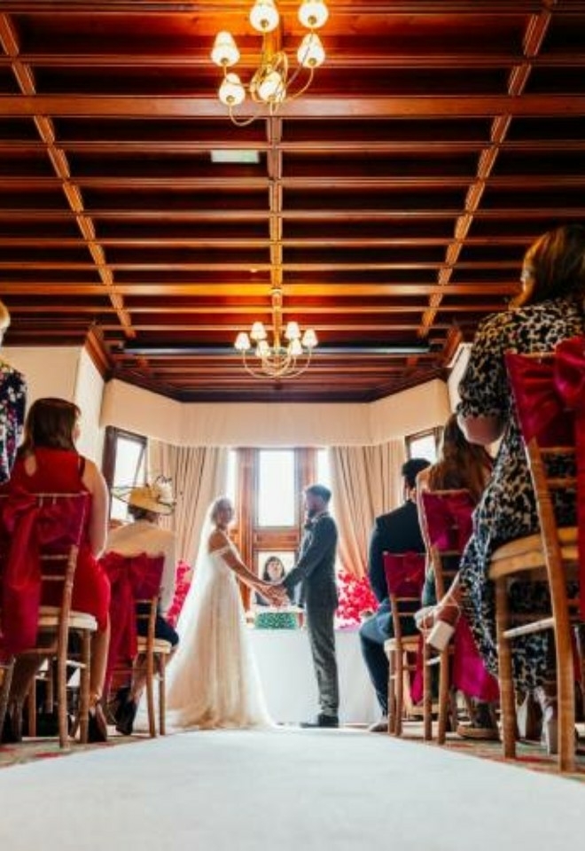 Photo of a ceremony in the Somerleyton Suite, taken from a low angle- Sprowston Manor Norwich
