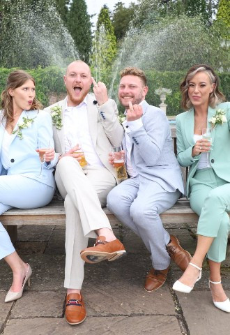 Arley House & Gardens two grooms pose with their wedding party after the wedding ceremony, photo taken by SMD Wedding  Photography, West Midlands