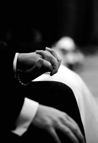 Bride and Groom hold hands