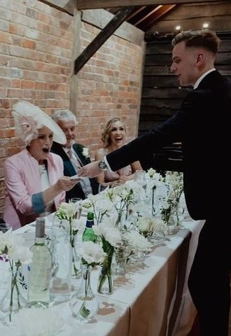 Wedding top table being entertained by Dean Leavy Magician