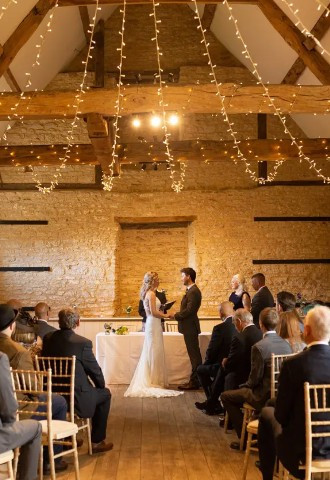 Wedding ceremony at Wick Farm in the barn