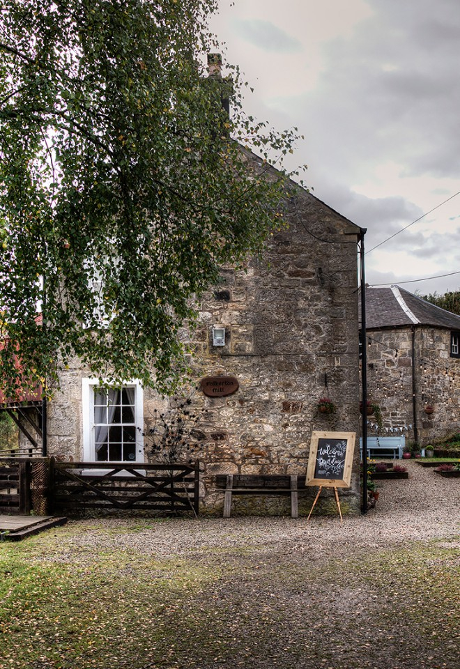 The view of the courtyard as you walk up the driveway at Folkerton Mill.
