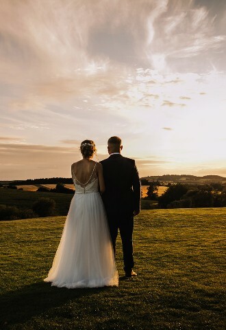 Bride and Groom at Sunset with rolling hill views