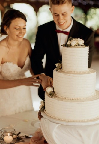 wedding couple cutting their wedding cake at Voco St Johns Solihul, West Midlands