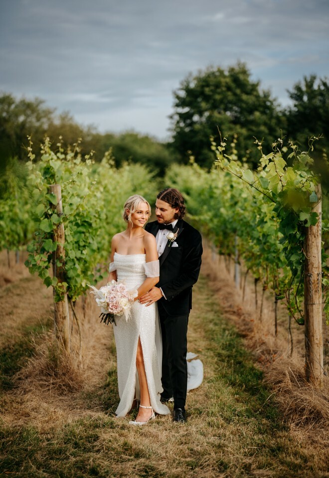 Bride and groom in the vineyard at High House
