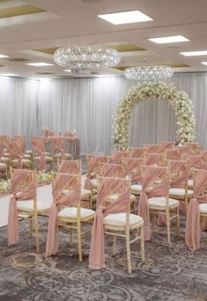 pink and white wedding with white floral arch