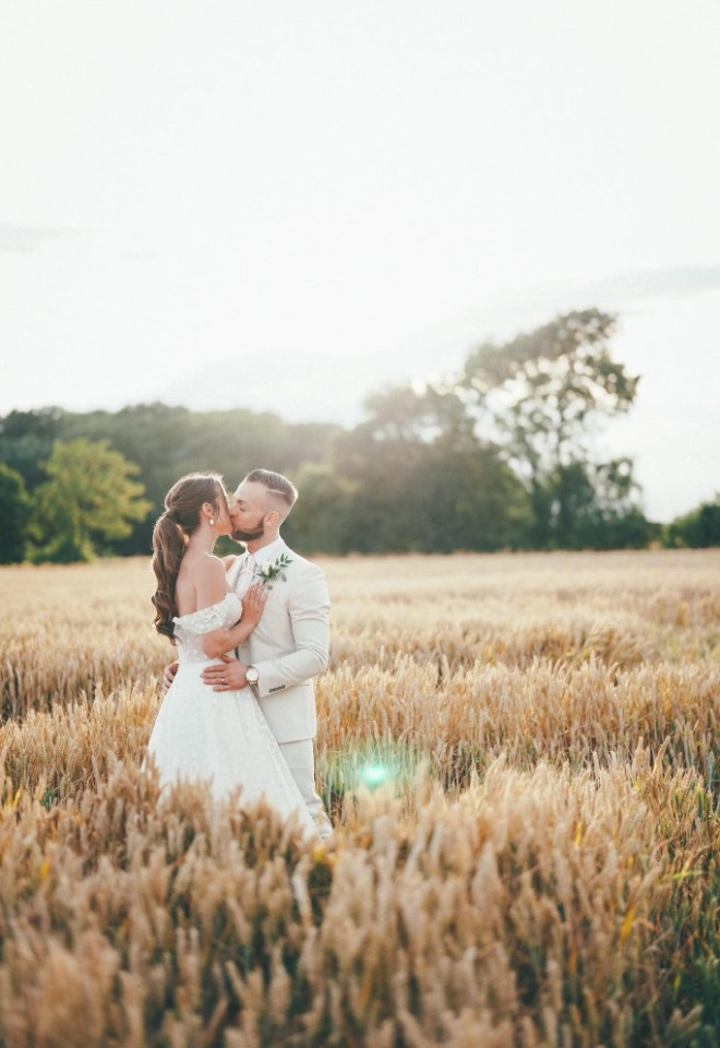 Wedding couple in barley field