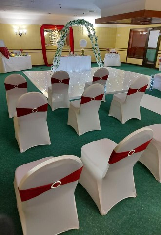 Wedding ceremony space with red chair decor