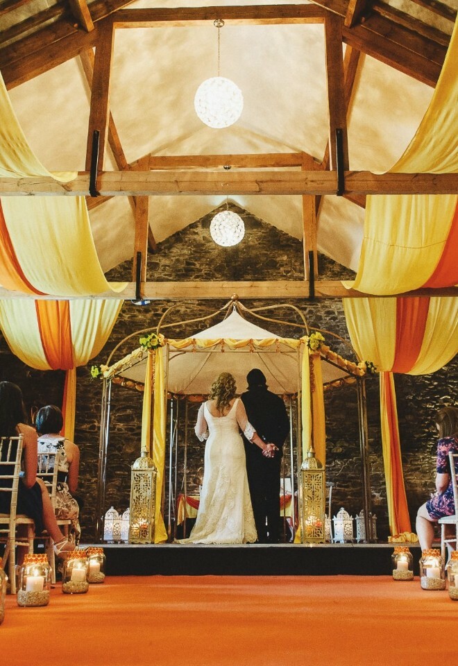 Wedding ceremony inside New House Farm barn