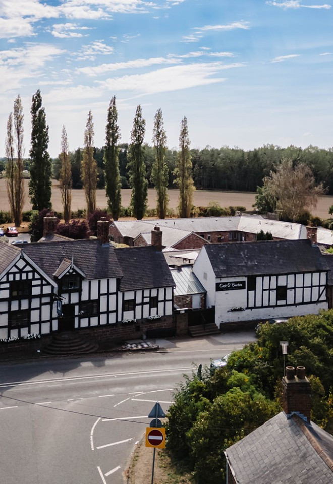 Aerial view of The Cock O’Barton wedding venue, surrounded by the Cheshire countryside.