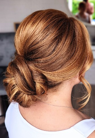Modern low bun bridal updo
