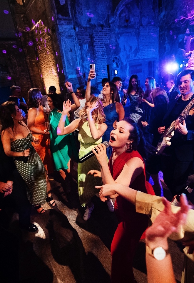 Band interacting with wedding guests