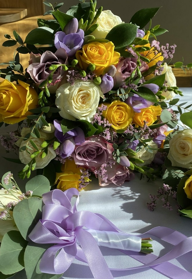 purple, yellow and cream flower bouquet by hire heaven
