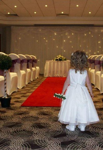 Flower Girl Looking Down Aisle at Holiday Inn Basildon Wedding Venue