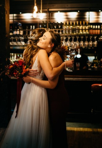 Bride hugs friend during wedding at The Crown & Thistle