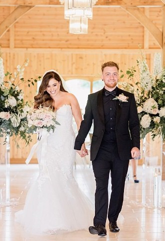 Bride and groom leave their wedding ceremony at Colshaw Hall, Cheshire