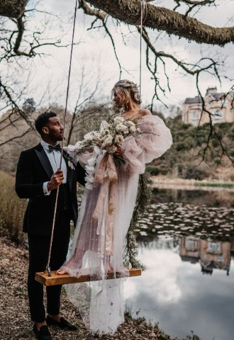 Bride & groom on swing at Auchen Castle - a romantic castle wedding venue in Scotland