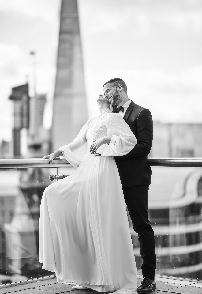 London wedding Four Seasons Ten Trinity Square bride and groom on balcony by Stuart Wood