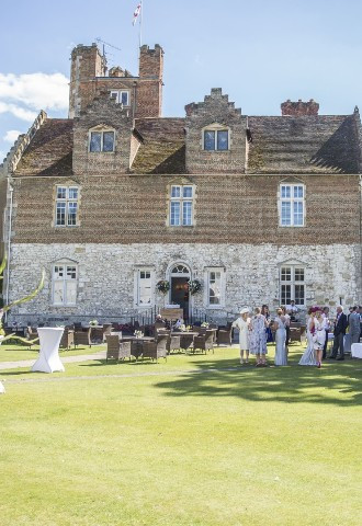 Exterior of Bisham Abbey with wedding recpetion in grounds