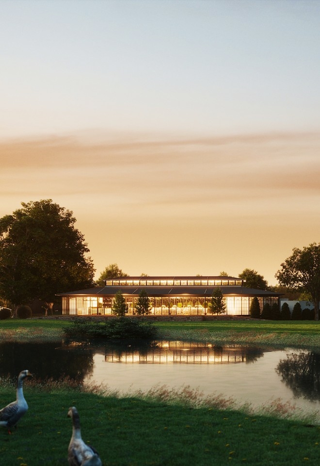 An exterior of The Orangery overlooking the lake coming in 2025 at High House Weddings in Essex