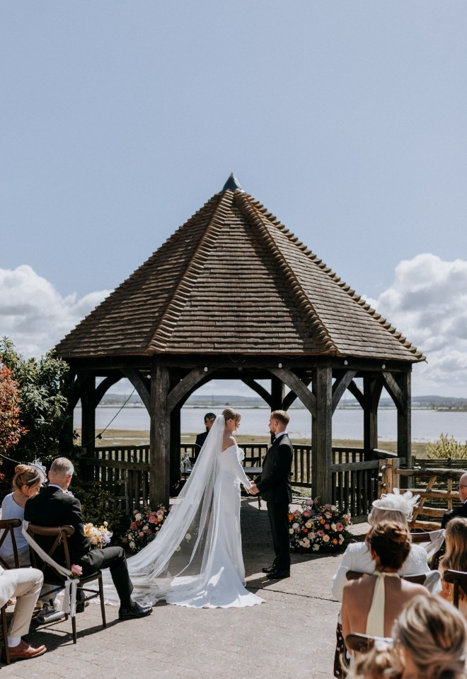 Outdoor wedding ceremony overlooking the Kent estuary