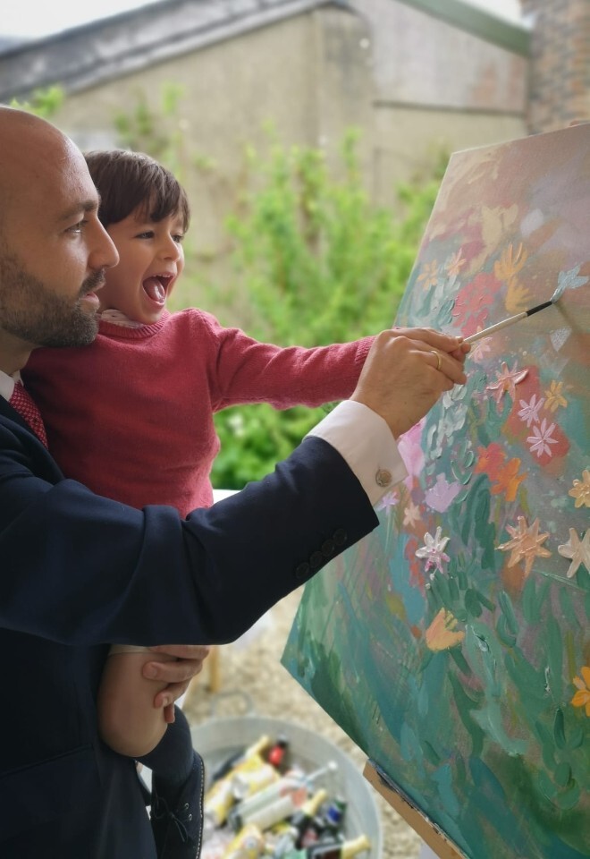 guest painting at wedding