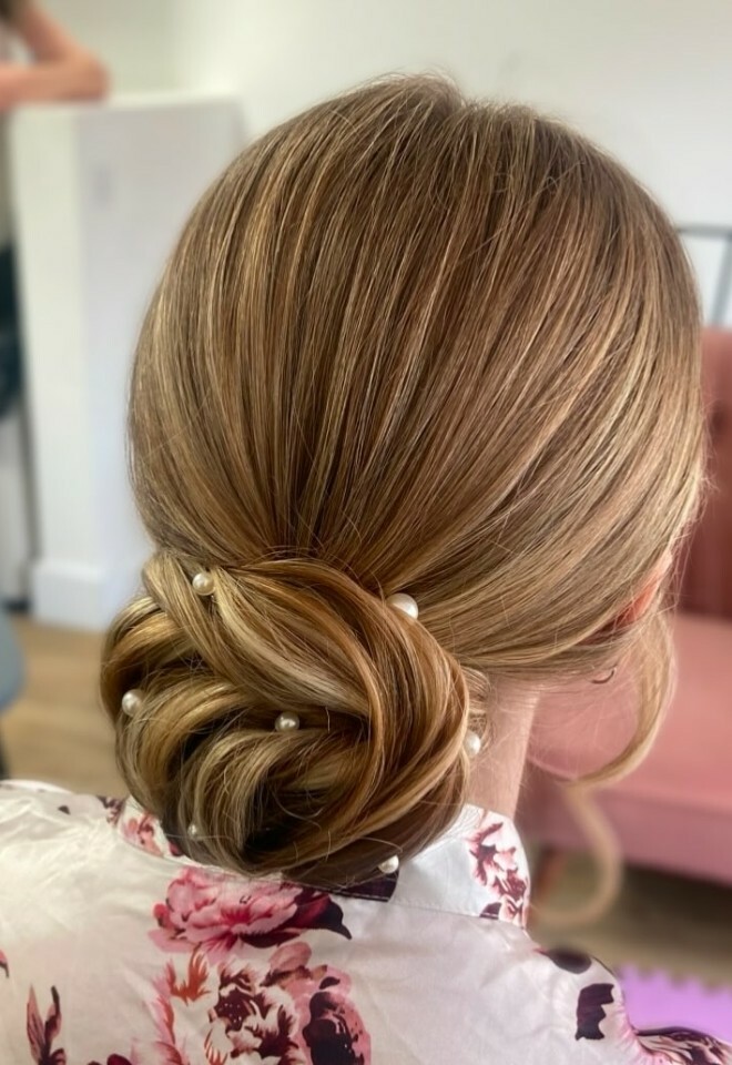 Low textured bun bridal hair by Holly Andersen