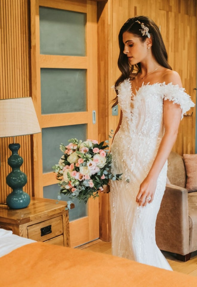 bride with bouquet in the guest accommodation at the Chilterns View wedding Venue