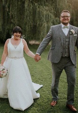 Bride and groom exploring the grounds at Glen Yr Afon House Hotel, Monmouthshire