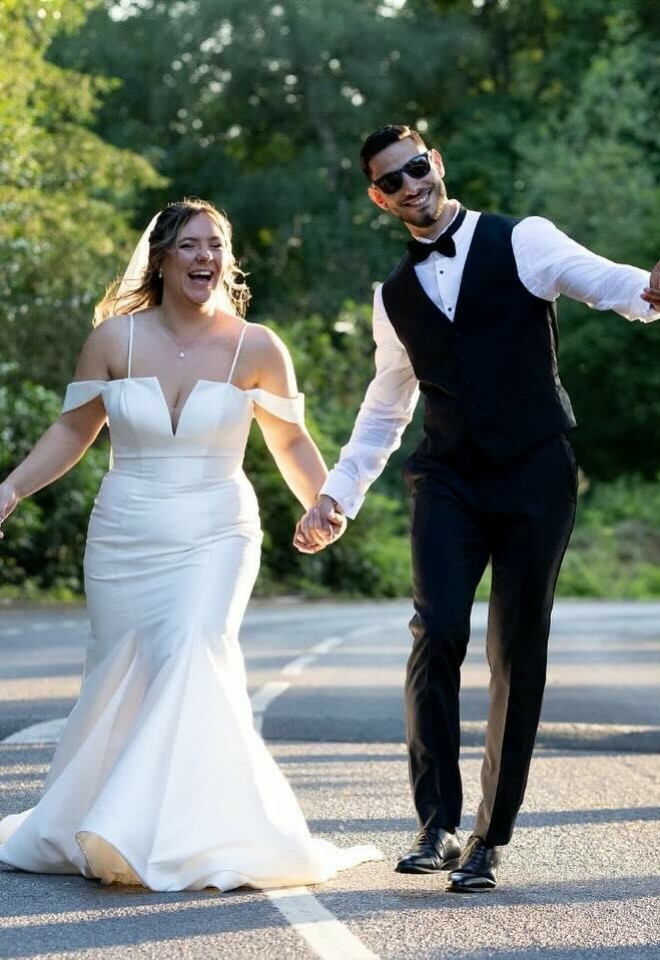 Bride and groom holding hands