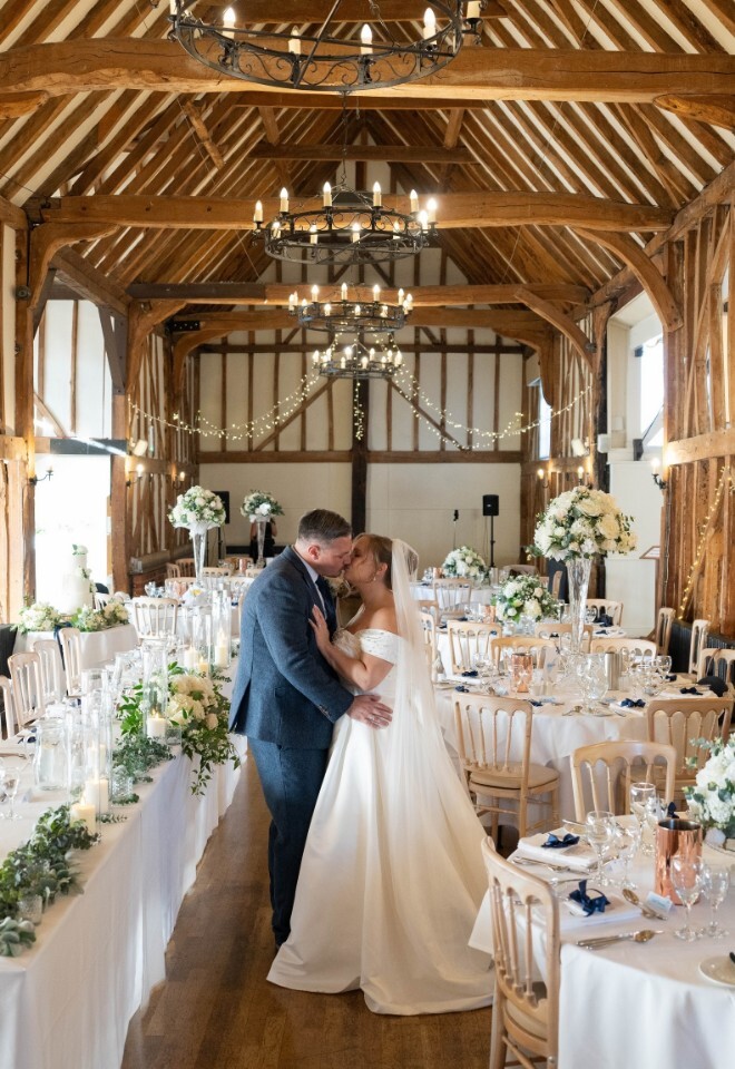 Wedding Breakfast with Couple Kissing