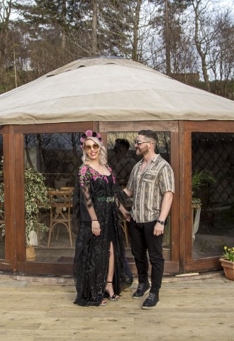 alternative couple outside 25ft event yurt at Eavestone Lake