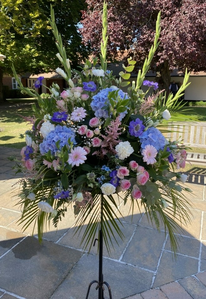 Pink and purple flower display by hire heaven