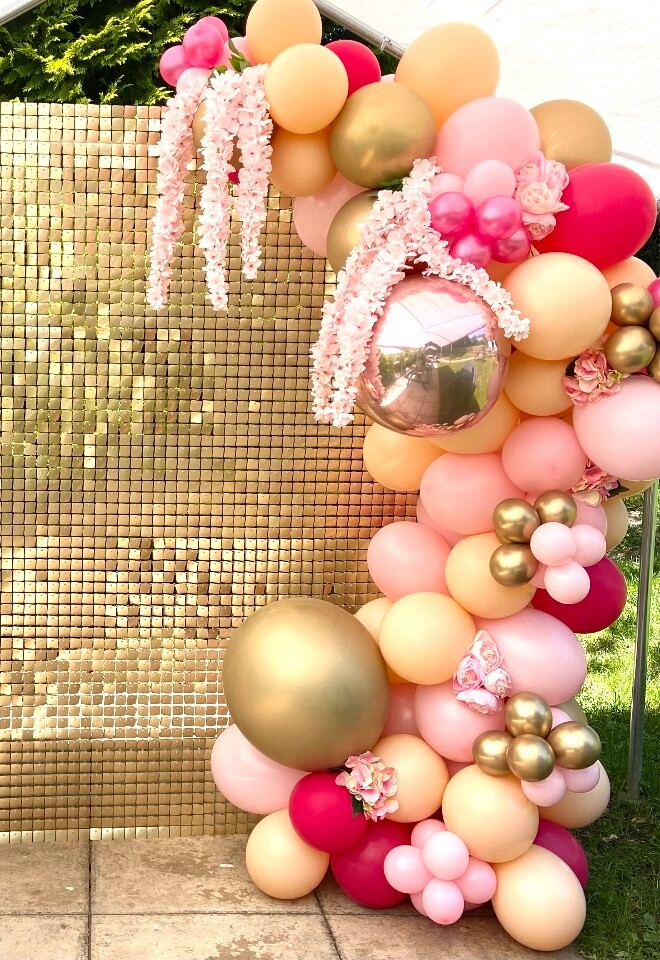Pretty balloons and sequin wall backdrop. 