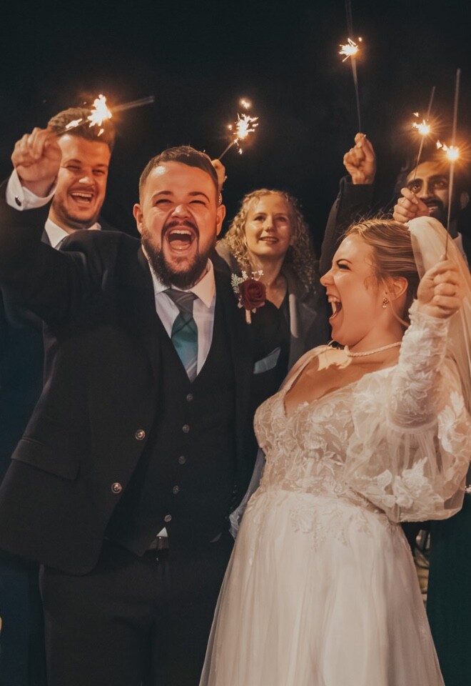 bride and groom with sparklers