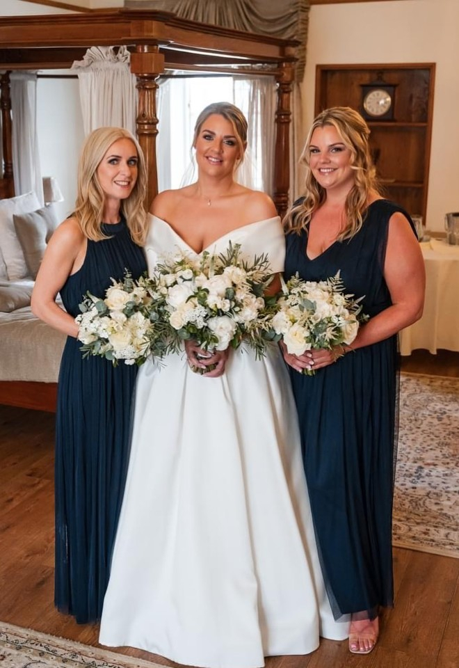 Bride and bridesmaid with wedding flowers