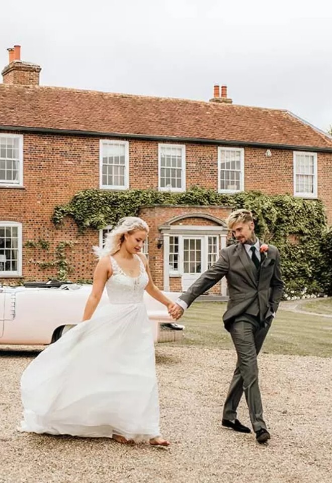 Couple outside Downham Hall Wedding Venue Essex