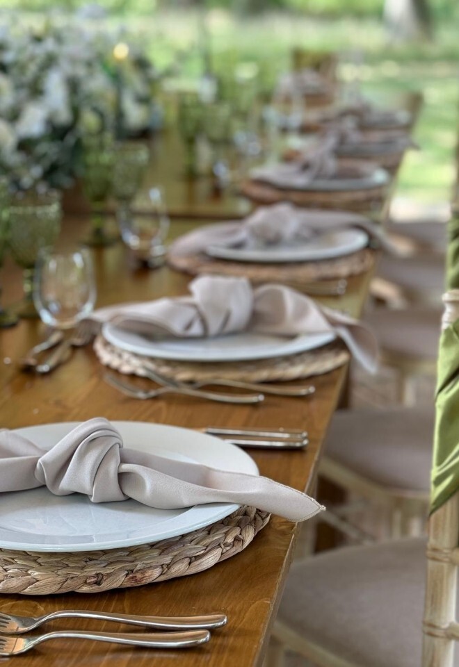 Natural Woodland Wedding with Green chair sashes and stone coloured napkins - adding natural charger mats for that outdoor experience.
