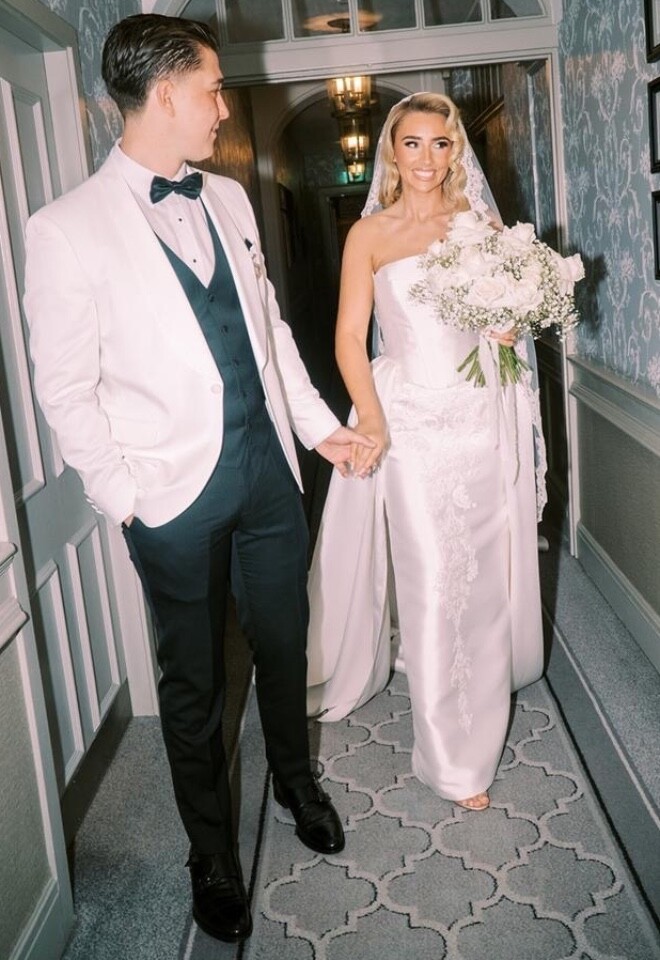 Glam bride and groom. All white rose bouquet.