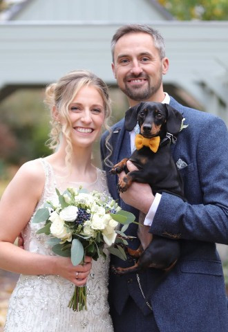 bride and groom pose with their sausage dog, Fairlawns      by SMD Wedding Photography                                   photo by SMD Photography, West Midlands