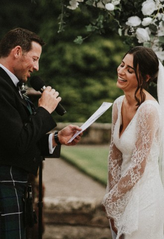 Wedding couple saying vows at Auchen Castle - romantic castle wedding venue in Scotland