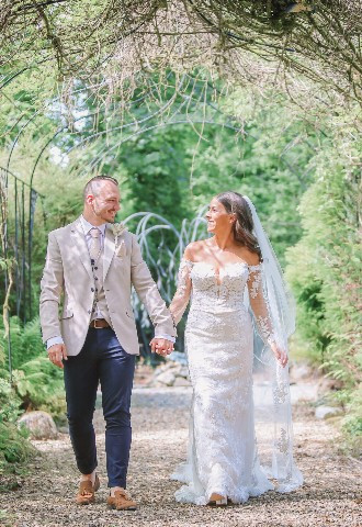 Garden wedding walk at Talhenbont Hall in Pwllheli, Gwynedd