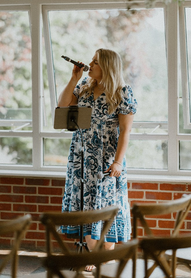 Berkshire wedding singer performing live music during a ceremony at the Old Mill Aldermaston