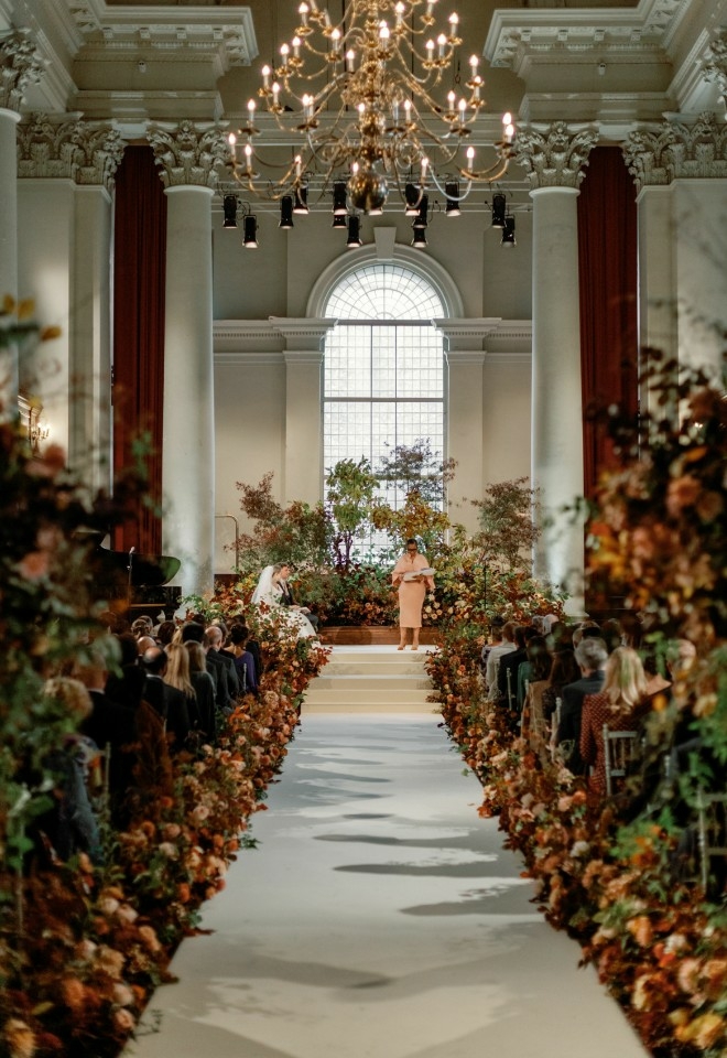 Jennifer Patrice, an experienced Independent Celebrant, with a happy couple on their wedding day, delivering an authentic, joyful, and personalised ceremony in a beautiful setting.