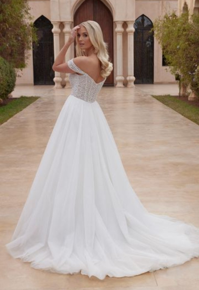 Bride wearing a Sincerity wedding dress available from Broomvale Bridal Barns