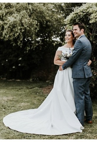 Bride and groom pose at The Secret Garden, Vale of Glamorgan